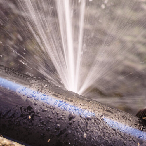 water pouring out of a pipe