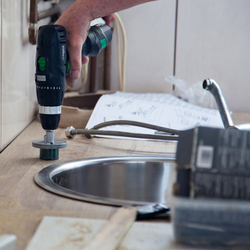 plumbers remodeling a kitchen